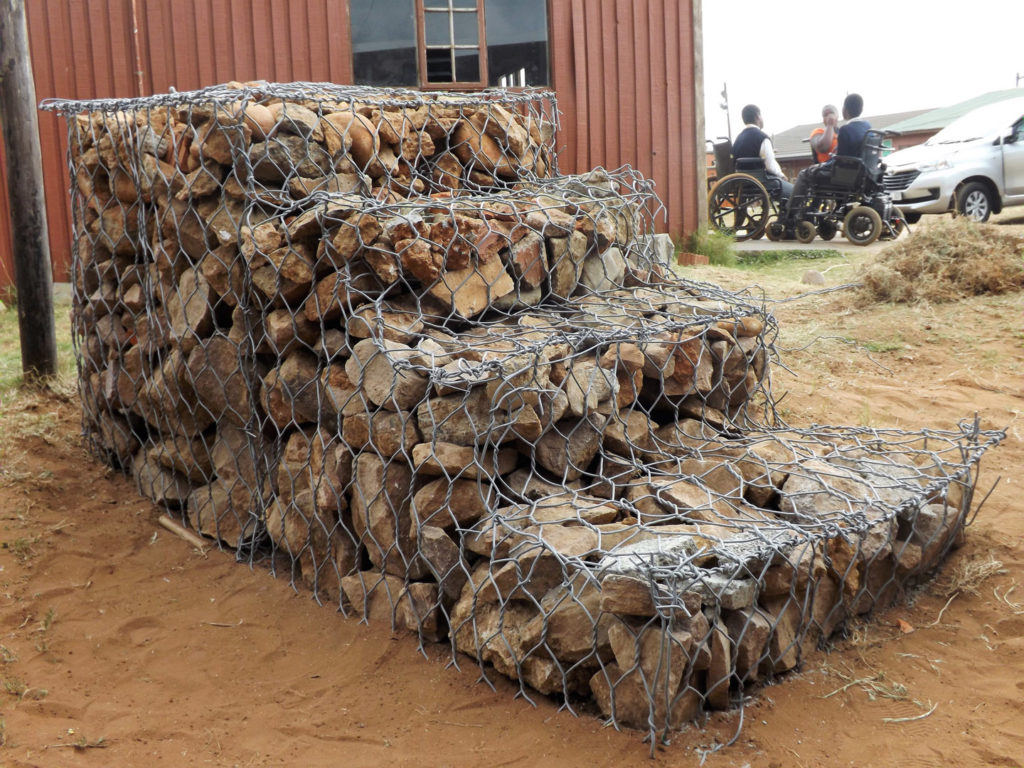 44. Mason Lincoln Steps to Success (g): The finished gabion filled with stones, approximately 3m (10 ft) long and 1.2 m (4 ft) high with four steps.